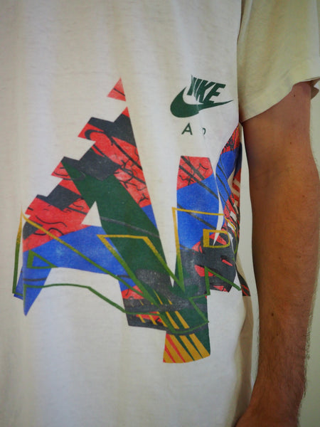 White vintage Nike T-shirt with side wrap around graphic